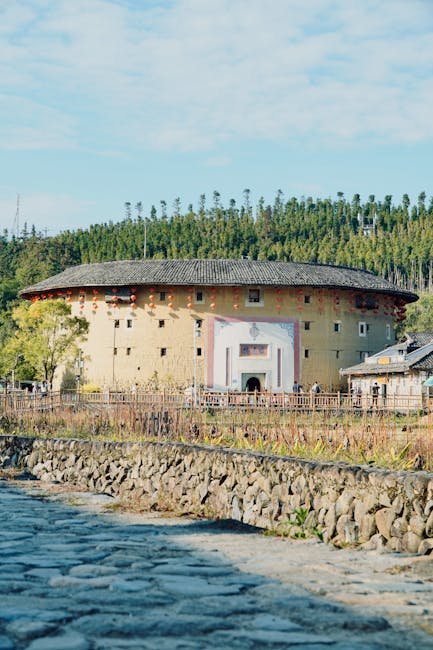 Traditional Minnan-style building with red-brick facade and ornate swallowtail roof ridge